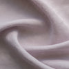 Close-up of light lilac-mauve inen fabric with visible texture