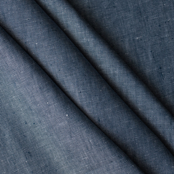 close up of Atlantic Twill linen fabric in denim-inspired blue with white flecks, twill weave, 100% linen, 225 GSM.