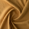 Close-up of Autumn Mustard extra wide 280cm 100% linen fabric 300gsm for jackets, aprons, cushions, curtains and structured home textiles with folds