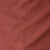 Close-up of a textured rust-colored fabric
