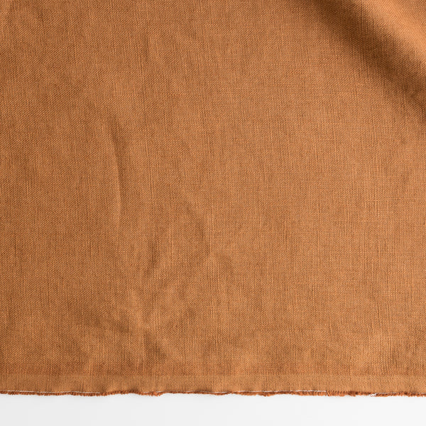 Close-up of Classic Tobacco extra wide 280cm 100% linen fabric 300gsm for jackets, aprons, cushions, curtains and structured home textiles on a white background