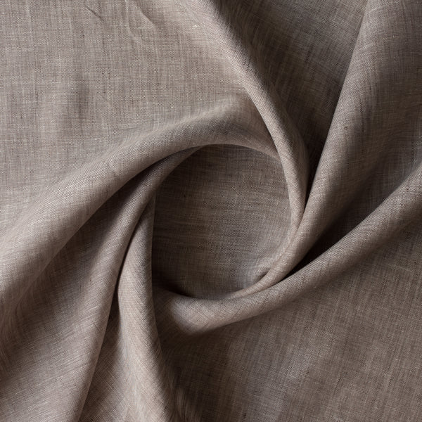 Close-up of Earthbound Chambray Linen fabric in a warm taupe stone shade, 100% linen, 145 GSM with chambray texture — close-up weave detail