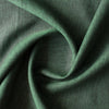 Close-up of Forest Chambray linen fabric in deep earthy green with green-and-black chambray weave, 100% linen, 160 GSM