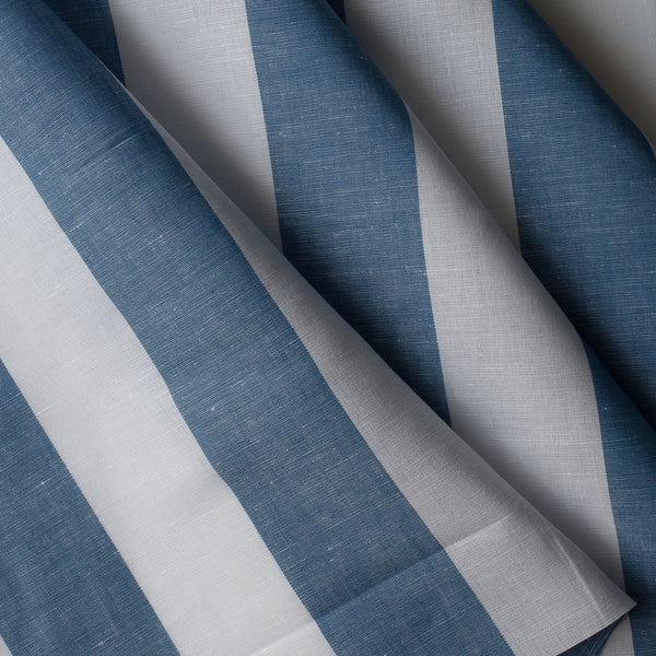 Close up of Marine Breeze Stripe linen–cotton fabric with jumbo blue and white yarn-dyed stripes, 135 GSM, 44 LEA