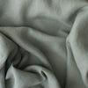 Close-up of Misty Sage extra wide 280cm 100% linen fabric 300gsm for jackets, aprons, cushions, curtains and structured home textiles with folds