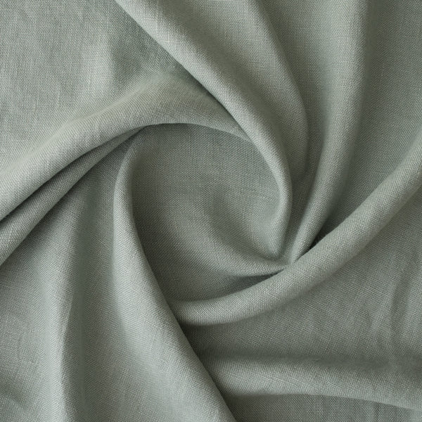 Close-up ofMisty Sage extra wide 280cm 100% linen fabric 300gsm for jackets, aprons, cushions, curtains and structured home textiles with folds