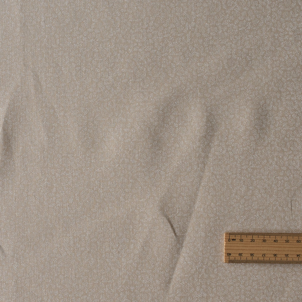 Whisper Sand linen fabric in sandy neutral tone with delicate white print, 100% linen, 175 GSM
