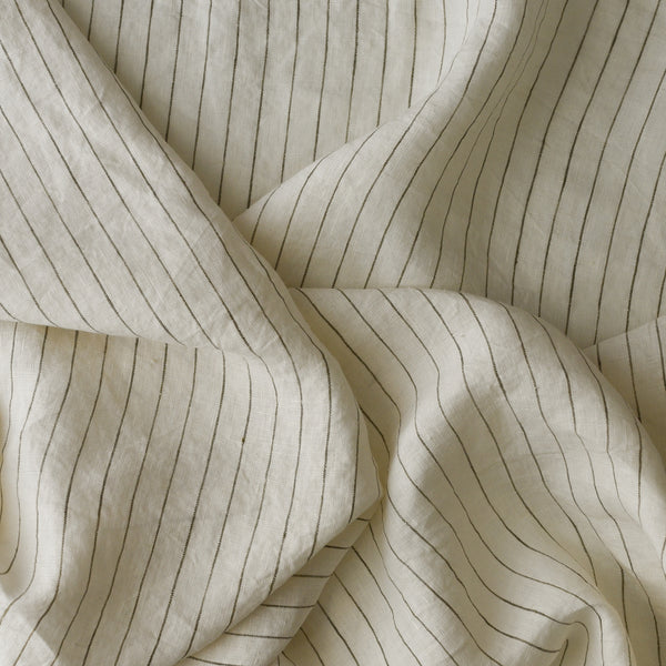 Olive Thread Stripe extra wide 100% linen fabric with off-white base and narrow olive stripe for curtains, bedding and table linen