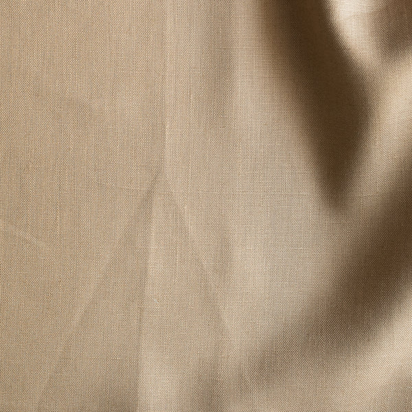 Close-up of Wheatfield Tan is a warm golden 100% linen fabric with folds