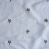 Wintertree Embroidery — pure white linen–cotton fabric with dark golden embroidered tree motif, 44 LEA