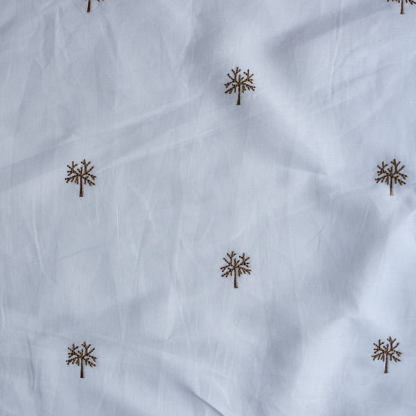 Wintertree Embroidery — pure white linen–cotton fabric with dark golden embroidered tree motif, 44 LEA