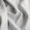 Sophisticated Chrome Grey Linen Fabric with a fine linen texture and a blend of white warp and grey weft, ideal for creating elegant and timeless clothing.