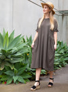 Elegant Eileen Dress pattern with shirred sleeve detail, gathered side waist, and round neckline, offering a blend of classic and modern style.