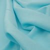 Fun and bright light blue linen fabric with a cyan base tone and relaxed slub texture