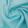 Fun and bright light blue linen fabric with a cyan base tone and relaxed slub texture