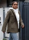 Logan Shacket sewing pattern, showcasing an oversized shirt-style jacket with dropped shoulders, large pockets, and twin needle topstitching, suitable for boiled wool, denim, corduroy, linen, or flannelette fabrics.