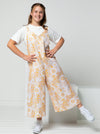 A fashionable Norman Teens jumpsuit sewing pattern with a “V” neck and wide legs, designed for comfort and style in teen sizes.